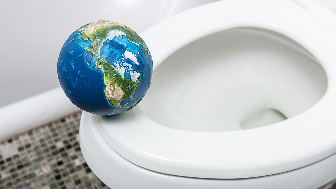 Toalettsits med en jordglob på ringen